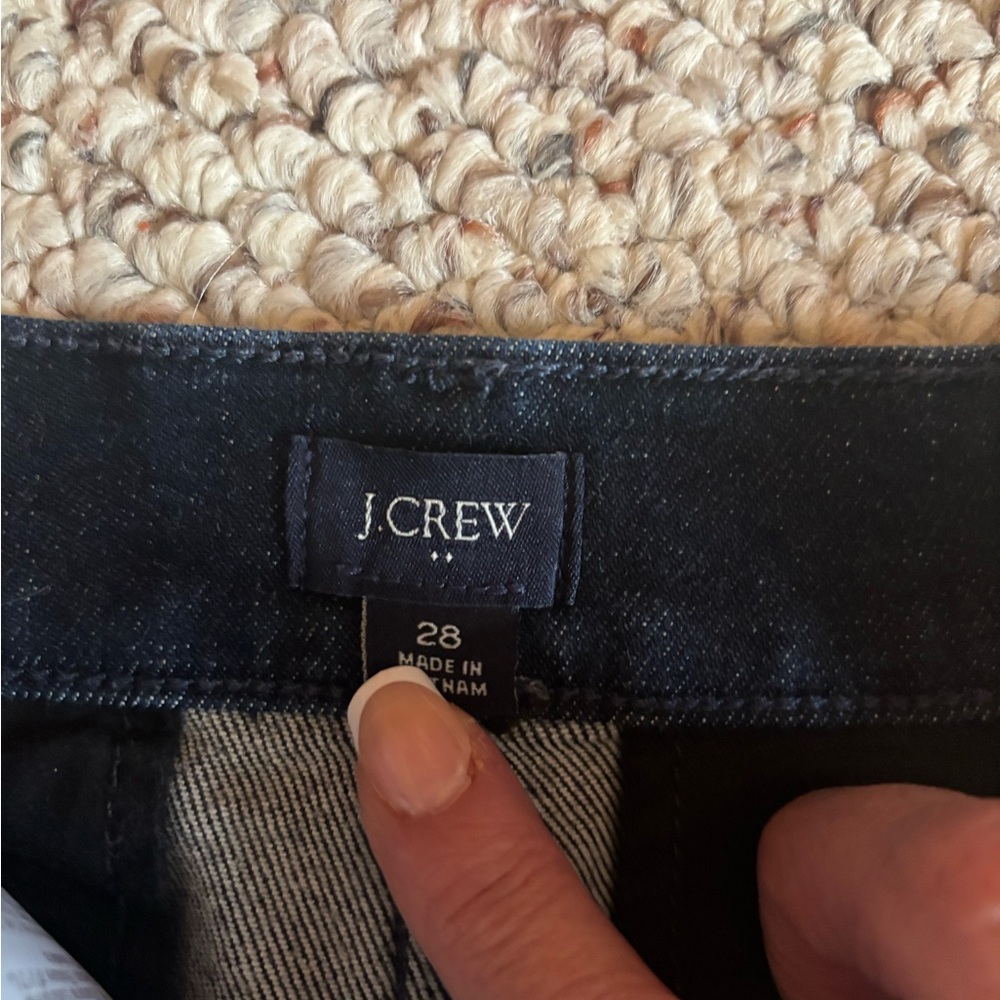 JCrew high waisted dark blue jeans.